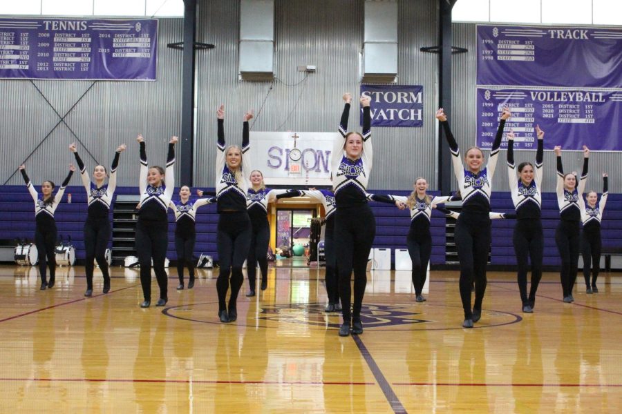 The dance team starts their performance at the fall sports pep rally 