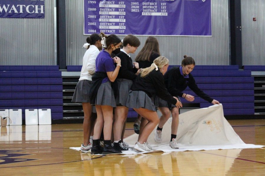 Sophomore Gretchen Kowalewich leads Maison Holmes in the magic carpet challenge