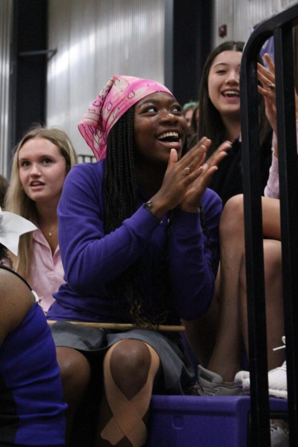 Senior Makaila Traylor claps her hand in excitement during Thursday's pep rally 