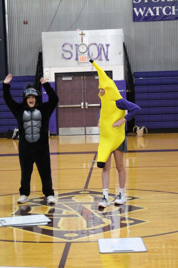 Dressed as a gorilla and a banana, sophomores Kate Spenceri and Bridget Bendorf lead the go bananas cheer 