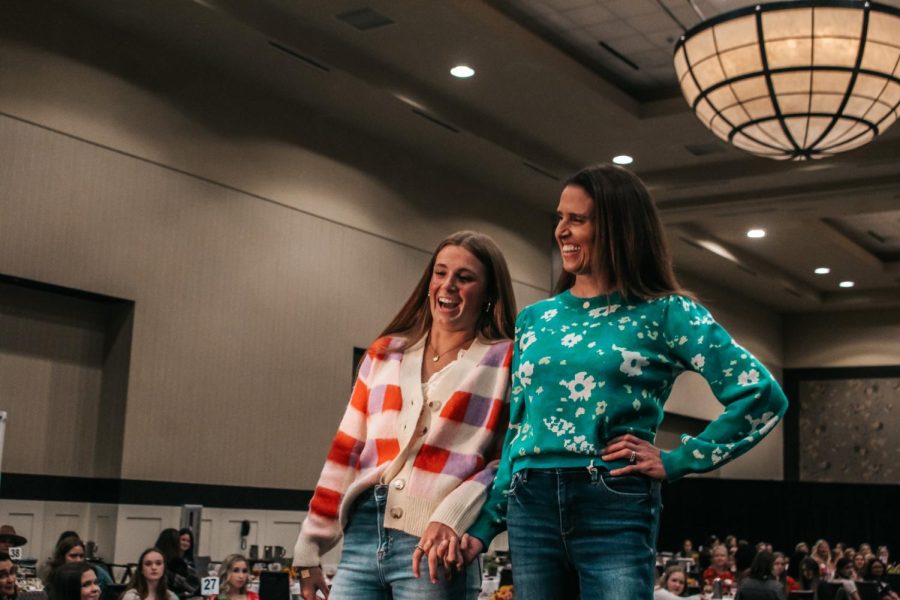 Senior Anna Golian leans into her mom Kara Golian at the end of the runway.