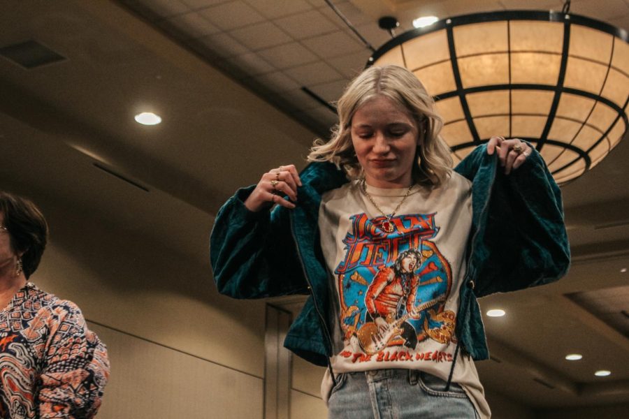 Senior Mo Browne shows off her jacket at the mother  daughter fashion show.