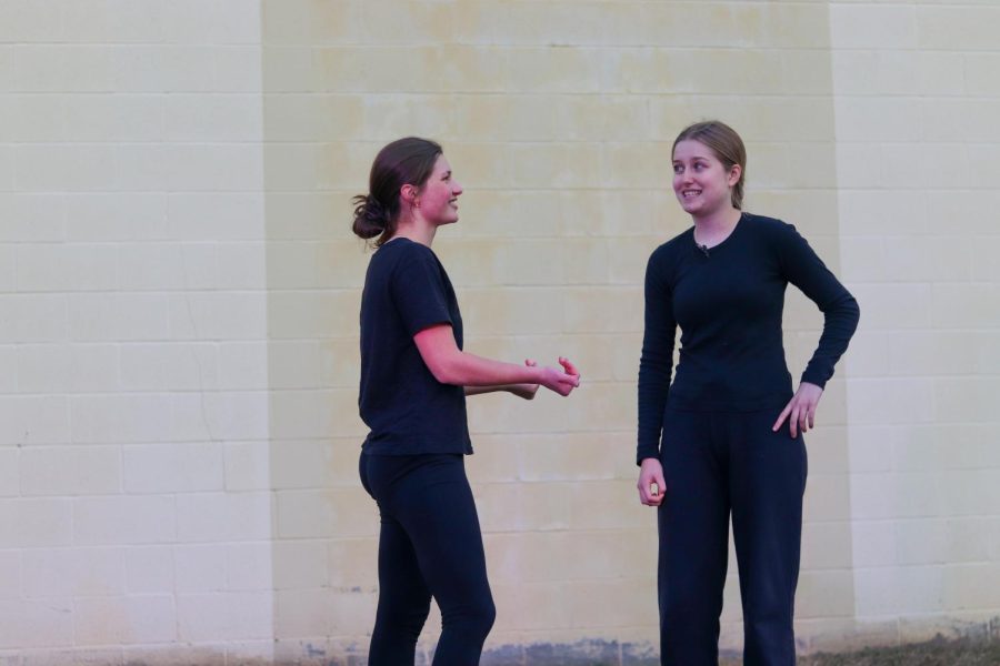 Junior Suzanne Sade demands Senior Lauren Millard give up her shoes during an improv skit.