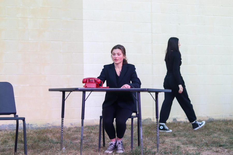 Junior Suzanne Sade rearranges her desk as a college admissions counselor.