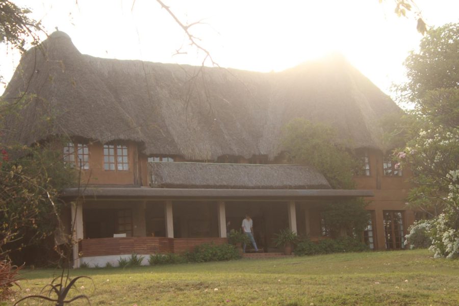 While visiting Lewa Wilderness lodge the sun streams over the roof.