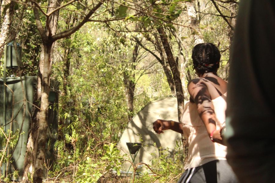 Kenyan student Diana grabs Kenyan student Sabina's hand.