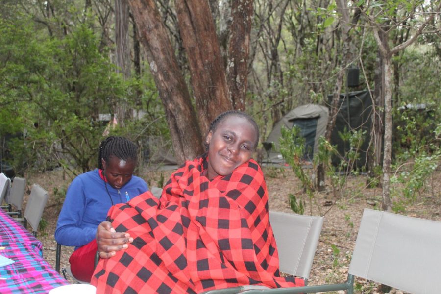 Kenyan student Diana smile for the camera while wrapped up in the traditional Maasai shuka.