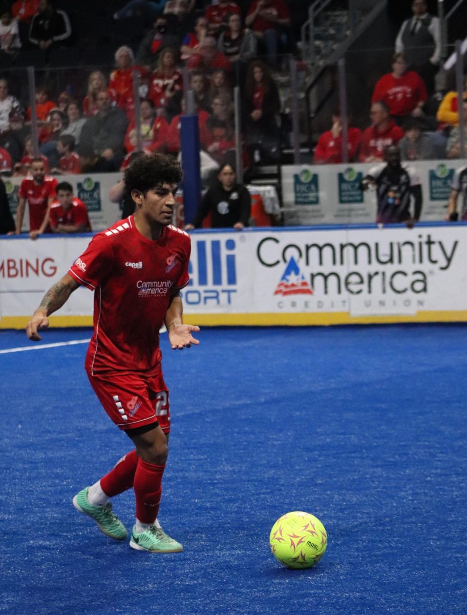 Midfielder Michael Lenis passes up to his teammates in the first quater of the Comet's game Feb. 10.
