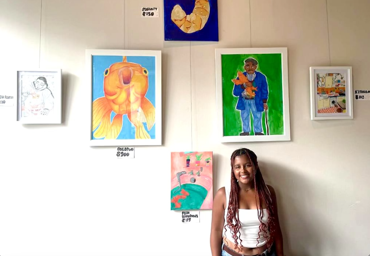 Sophomore Jae High stands with her art work at KC Wineworks  