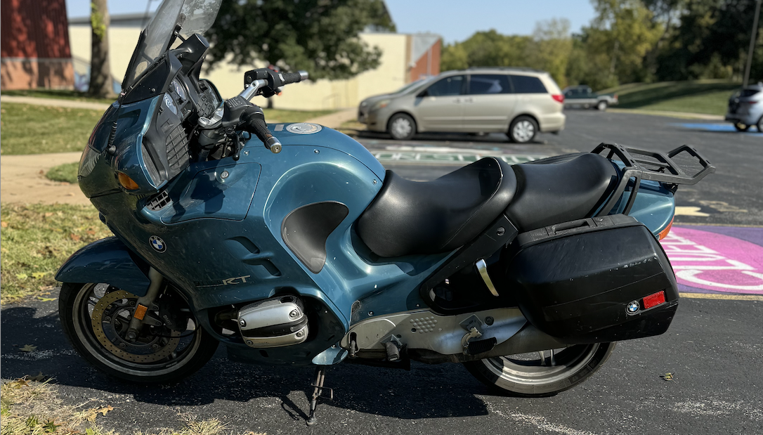 Catholic social teachings professor Paul Kramschuster's motorcycle parked in the senior parking lot.   